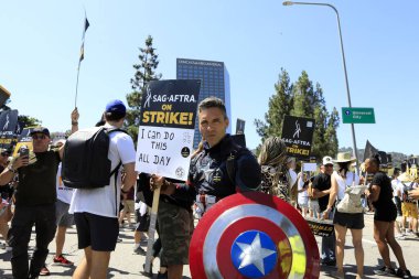 LOS ANGELES - AUG 4:  Strikers at SAG/AFTRA and WGA Strike at the Universal Studios on August 4, 2023 in Universal City, CA clipart