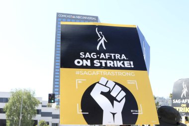 LOS ANGELES - AUG 4:  Strikers at SAG/AFTRA and WGA Strike at the Universal Studios on August 4, 2023 in Universal City, CA clipart