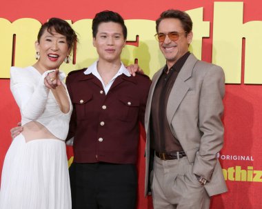 LOS ANGELES - APRIL 9: actors Sandra Oh, Hoa Xuande, Robert Downey Jr at the The Sympathizer HBO Premiere Screening at the Paramount Theater on April 9, 2024 in Los Angeles, CA clipart