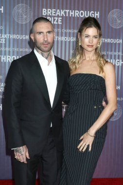 LOS ANGELES, USA - APRIL 13:  Adam Levine, Behati Prinsloo at the 10th Annual Breakthrough Prize Ceremony at the Academy Museum of Motion Pictures on April 13, 2024 in Los Angeles, CA clipart