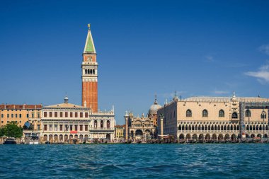 Authentic view of Piazza San Marco from the water on a sunny day, real tourists on the main street of Venice near the seaside admire the beautiful sights, interesting holidays and travels in Italy