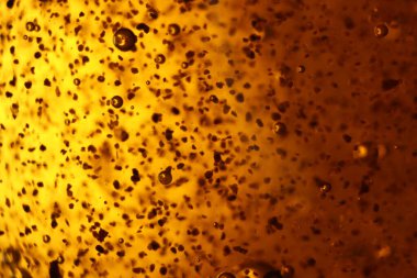 Soyut altın arka plan kabarcıkları nadir şekillerde farklıdır