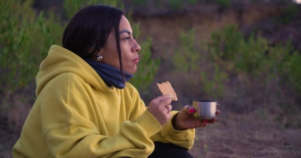 Beautiful Mexican Woman Watches Sunrise Mountain While Enjoys Cookie Coffee — Stock Video