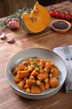 pumpkin stew with tomato sauce and vegetables