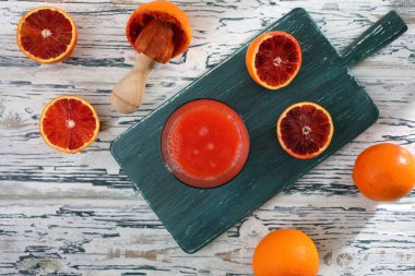 fresh orange juice and grapefruit on wooden background