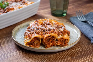 homemade lasagna with chicken and tomato sauce