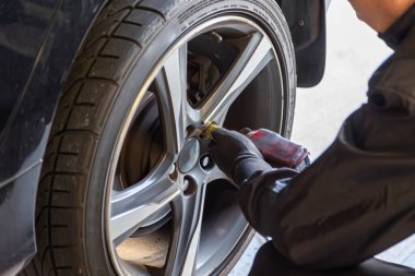 Where brake pads and tires are changed at an automobile repair shop