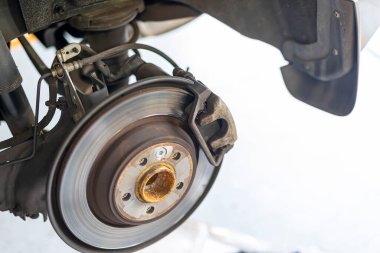 Where brake pads and tires are changed at an automobile repair shop