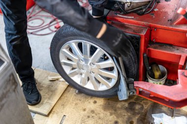 Where brake pads and tires are changed at an automobile repair shop
