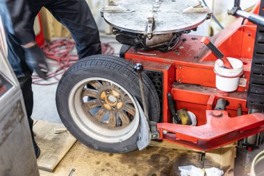 Where brake pads and tires are changed at an automobile repair shop