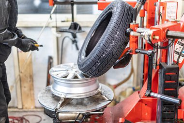 Where brake pads and tires are changed at an automobile repair shop
