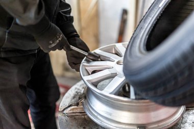 Where brake pads and tires are changed at an automobile repair shop