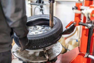 Where brake pads and tires are changed at an automobile repair shop