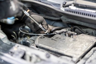 Where brake pads and tires are changed at an automobile repair shop