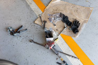 Where brake pads and tires are changed at an automobile repair shop