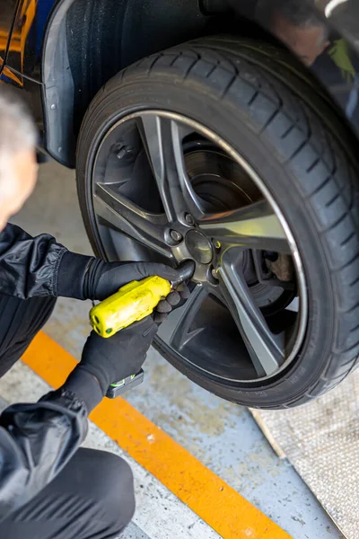 Where brake pads and tires are changed at an automobile repair shop
