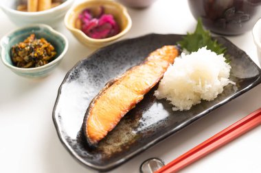Japanese breakfast consists of healthy grilled fish and lots of side dishes
