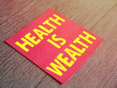 Health is wealth, text words typography written on paper, life and health motivational inspirational concept