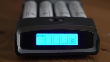 Close up charging battery process, lithium AA AAA rechargeable battery 