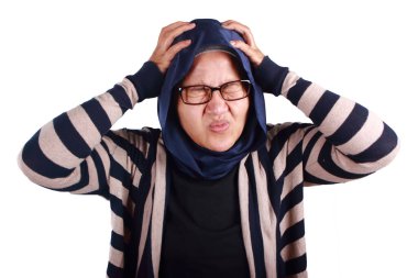 Frustrated stress Asian muslim woman hold her head, depressed anxiety gesture, headache pain expression, isolated on white