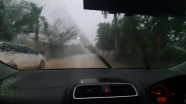 Car trip during heavy rain, passenger or driver POV, road journey transportation in stormy day