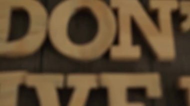 Don't give up, text words typography written with wooden letter, life and business motivational inspirational concept