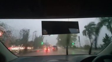Car trip during heavy rain, passenger or driver POV, road journey transportation in stormy day