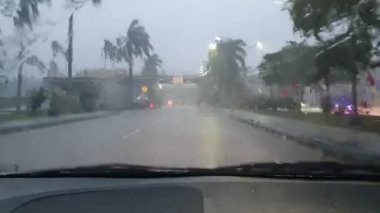 Car trip during heavy rain, passenger or driver POV, road journey transportation in stormy day