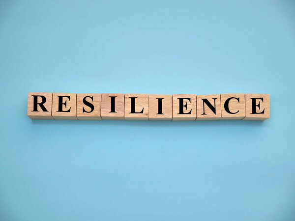 Resilience, text words typography written with wooden letter, life and business motivational inspirational terms concept