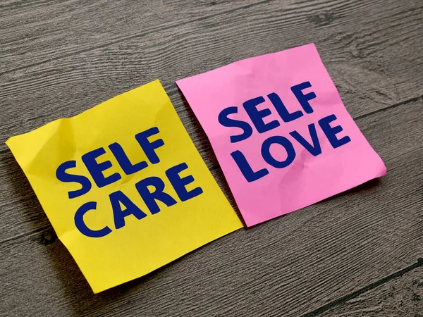 Self care and self love, text words typography written on paper, life and business motivational inspirational concept