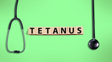 Tetanos, ahşap harf, sağlık ve tıbbi konsept ile yazılmış tipografi