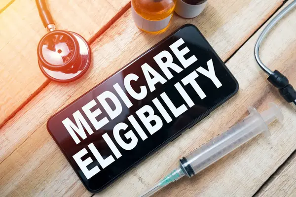 stock image Medicare eligibility, text words typography written on smart phone, health and medicine concept