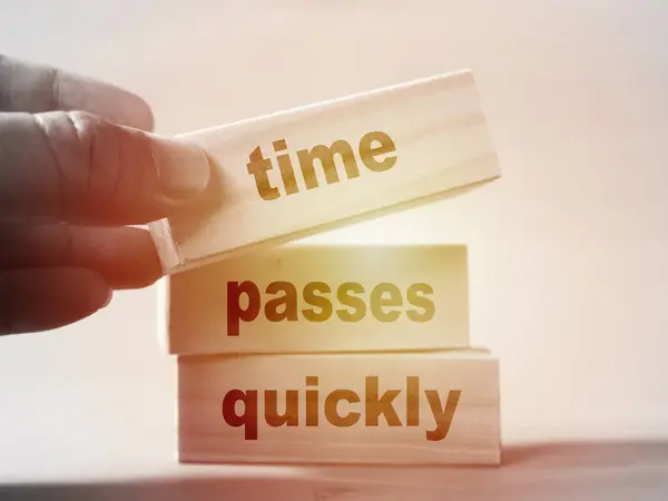Time passes quickly, text words typography written on wooden blocks, life and self development concept