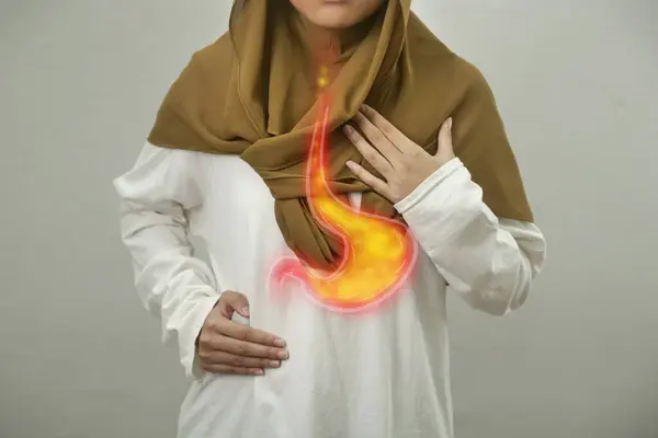 Digital composition of internal digestive system with stomach acid flows back to esophagus on person with GERD disease, woman with suffer from heartburn pain in her chest, health and medical concept