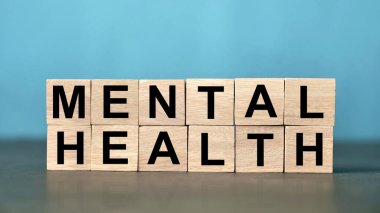 Mental health text written on wooden lettering, psychology well-being concept clipart