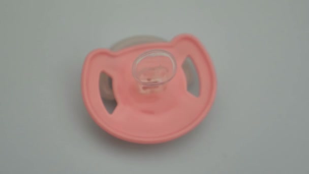 Pink Baby Pacifier Blue Background — Stock Video