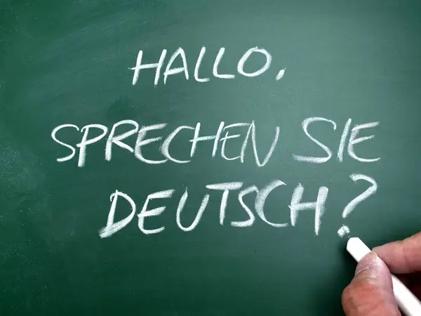 Sprechen sie deutsch, do you speak germany question. Language skill concept, text written on chalkboard