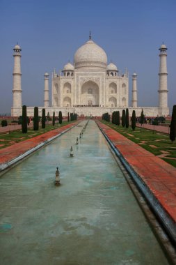 Taj Mahal with reflecting pool in Agra, Uttar Pradesh, India. It was build in 1632 by Emperor Shah Jahan as a memorial for his second wife Mumtaz Mahal. clipart
