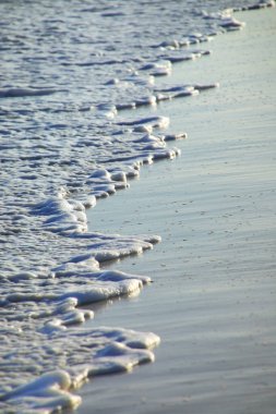 Fayaoue sahilinde, Ouvea lagünü, Ouvea ve Mouli Adaları 'nda, Yeni Kaledonya' da sörfün yakın çekimleri. Lagün 2008 yılında Unesco Dünya Mirası olarak listelendi..