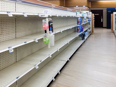 Bronx, New York - December 28, 2022: Empty shelves at a local Rite Aid store with merchandise hidden to avoid theft.