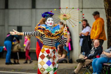 Portland, Oregon, USA - June 11, 2022: Character Clown Corps in the Grand Floral Parade, during Portland Rose Festival 2022.