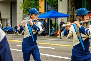 Portland, Oregon, USA - June 11, 2022: Interlake High School Marching Band in the Grand Floral Parade, during Portland Rose Festival 2022.
