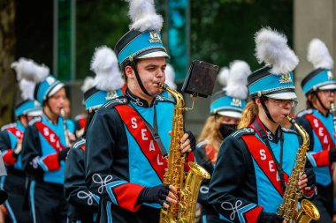 Portland, Oregon, USA - June 11, 2022: Chief Sealth International High School Marching Band in the Grand Floral Parade, during Portland Rose Festival 2022.