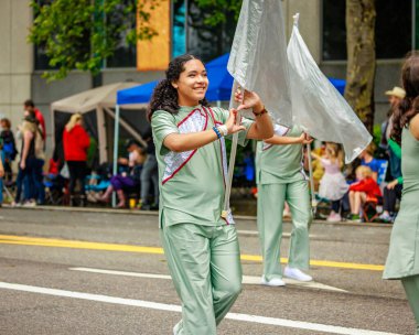 Portland, Oregon, USA - June 11, 2022: Franklin High School Marching Band in the Grand Floral Parade, during Portland Rose Festival 2022.
