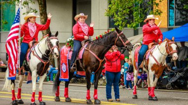 Portland, Oregon, USA - June 11, 2022: Clark County Fair Mounted Patrol in the Grand Floral Parade, during Portland Rose Festival 2022.
