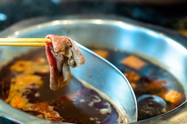 Chopstick with beef Shabu Shabu as Japon suki yaki. 