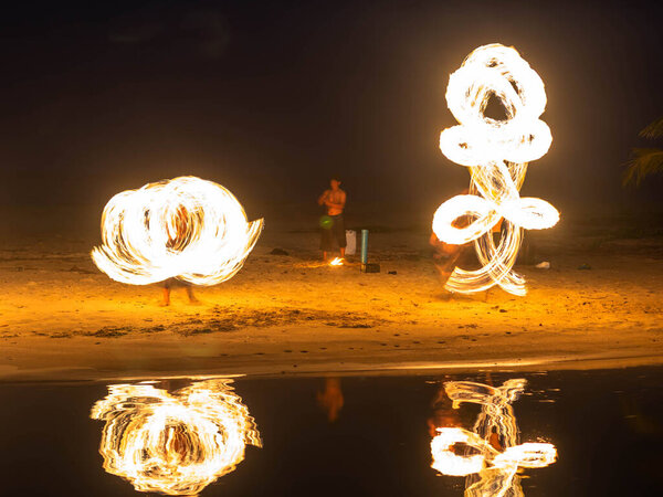 Fire dancers Swing fire dancing show fire show on the beach dance man juggling with fire 