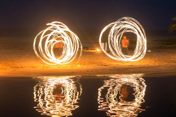 Fire dancers Swing fire dancing show fire show on the beach dance man juggling with fire