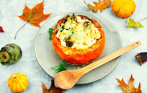 Half baked squash stuffed with mushrooms, spinach and artichoke. Autumn recipe
