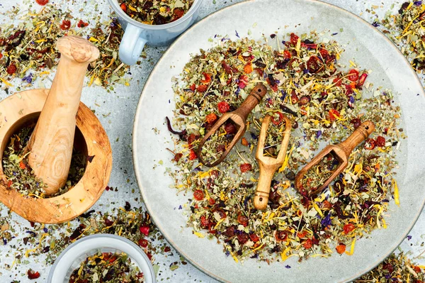 Herbal tea with healthy herbs tea in wooden spoons